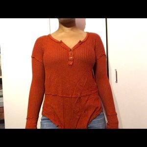 Rust colored long-sleeve top